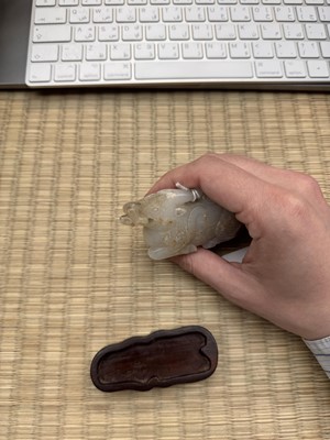 Lot 108 - A CHINESE PALE CELADON 'WATER BUFFALO' JADE CARVING