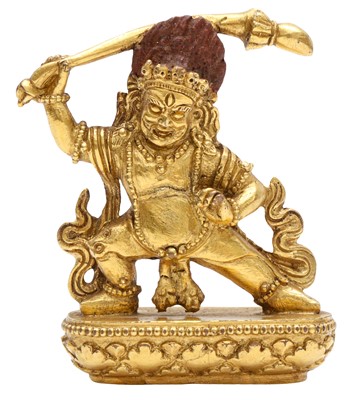 Lot 673 - A SMALL SINO-TIBETAN GILT-BRONZE FIGURE OF VAJRAPANI