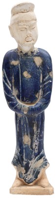 Lot 717 - A CHINESE BLUE-GLAZED FIGURE OF AN ATTENDANT