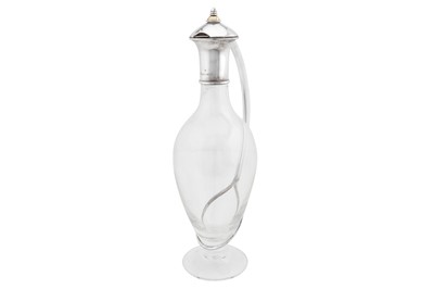 Lot 371 - An Elizabeth II contemporary Elizabeth II sterling silver mounted glass ‘curve’ claret jug, Birmingham 2000 by Martyn Pugh