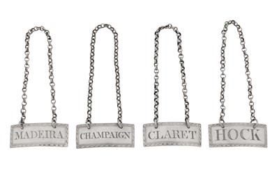 Lot 42 - A set of four George III Irish silver wine labels, Dublin circa 1810 by James Fray, retailed by Jacob West