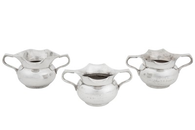 Lot 89 - Three late 19th century Indian colonial silver double lipped milk jugs or sauce boats, Calcutta, Bhowanipore dated 1894 by Grish Chunder Dutt