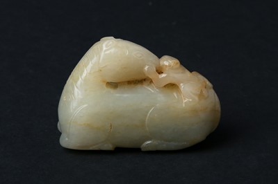 Lot 74 - A CHINESE RUSSET JADE 'RECUMBENT HORSE AND MONKEY' CARVING