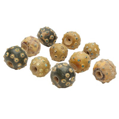 Lot 243 - A group of ten Chinese glass 'eye' beads, Eastern Zhou - Han dynasty