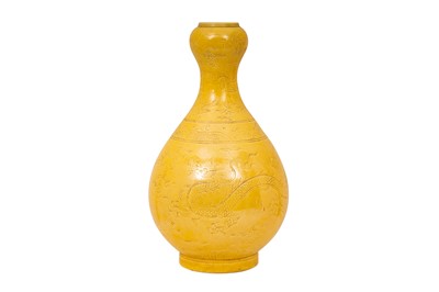 Lot 54 - A CHINESE MONOCHROME YELLOW-GLAZED INCISED VASE