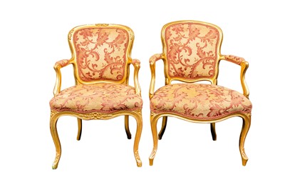 Lot 53 - A near pair of Louis XV style giltwood fauteuils, mid to late 19th century