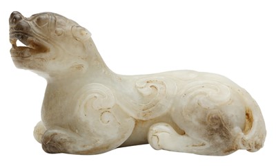 Lot 609 - A CHINESE CELADON AND GREY JADE 'BIXIE' CARVING