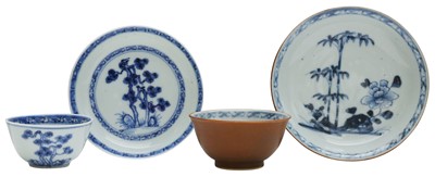Lot 531 - A PAIR OF CHINESE BLUE AND WHITE 'FLORAL' NANKING CARGO CUPS AND SAUCERS