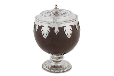 Lot 480 - A William III unmarked silver mounted covered coconut cup, probably England circa 1700