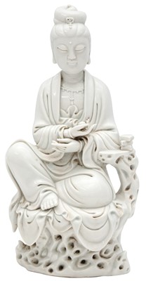 Lot 216 - A CHINESE DEHUA FIGURE OF A SEATED GUANYIN