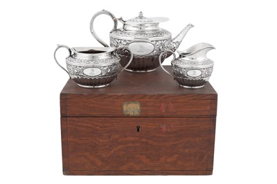 Lot 419 - A cased Victorian sterling silver three-piece tea service, Sheffield 1897 by Sibray, Hall and Co