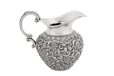 Lot 171 - A late 19th century Anglo – Indian silver cream jug, Cutch, Bhuj circa 1895 by Oomersi Mawji Jnr (active circa 1890-1930)