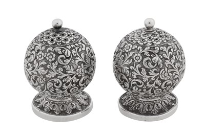 Lot 159 - A pair of late 19th century Anglo – Indian silver pepper casters, Cutch, Bhuj circa 1880 by Oomersi Mawji (active circa 1860-90)