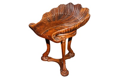 Lot 28 - A late 19th century Italian carved walnut grotto piano stool