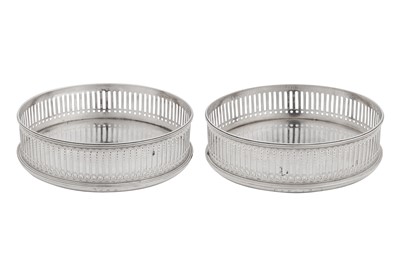 Lot 457 - A pair of George III sterling silver wine coasters, London 1791 by William Plummer (free. 1746, d. 1791)