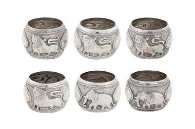 Lot 193 - A set of six mid-20th century Ceylonese (Sri Lankan) silver napkin rings, Kandy circa 1950