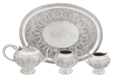 Lot 127 - An early 20th century Anglo – Indian unmarked silver three-piece tea service on tray, Bombay circa 1910