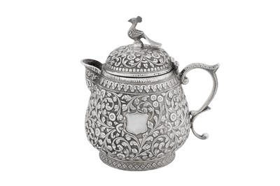 Lot 148 - A late 19th century Anglo – Indian unmarked silver covered jug, Cutch circa 1890