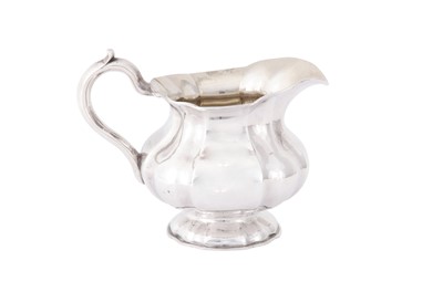 Lot 269 - An Alexander II Russian 84 zolotnik (875 standard) silver milk jug, Saint Petersburg 1868, by Henrik Hacklin (born Finland 1816, active from 1846)
