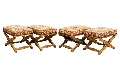 Lot 5 - A set of four French Empire giltwood X-framed stools, early 19th century