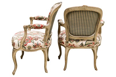 Lot 7 - A pair of Louis XV style French green painted fauteuils, 19th century