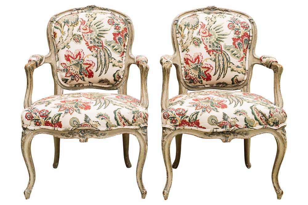 Lot 7 - A pair of Louis XV style French green painted fauteuils, 19th century