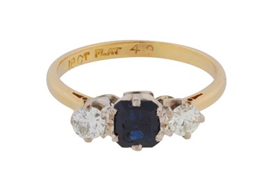 Lot 85 - A sapphire and diamond three-stone ring