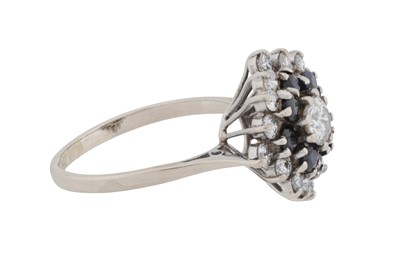 Lot 65 - A diamond and sapphire ring