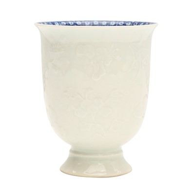 Lot 4 - A Chinese blanc-de-chine relief-decorated cup, Qing dynasty, Kangxi period