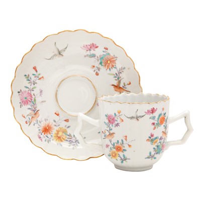 Lot 160 - A Chinese export famille-rose chocolate cup and saucer, Qing dynasty, 19th century