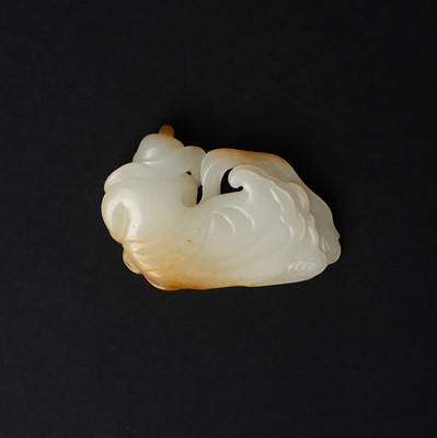 Lot 98 - A Chinese pale-celadon and russet jade 'boy' carving, Qing dynasty