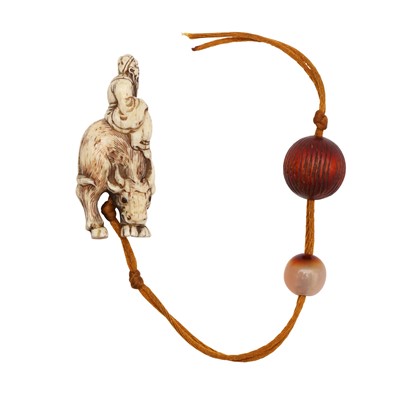 Lot 59 - A Japanese 'scholar and buffalo' bone netsuke group, Meiji period