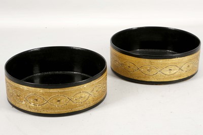 Lot 461 - A pair of Regency papier mache wine coasters...