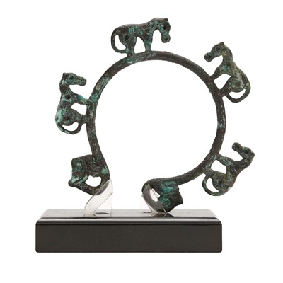 Lot 154 - A Chinese archaic bronze 'four horses' fixture, Warring States period