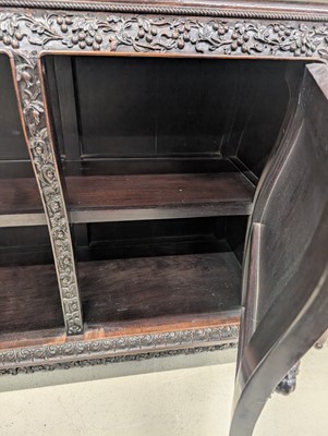 Lot 130 - A fine Chinese export carved and pierced hardwood (hongmu) display cabinet, late 19th century
