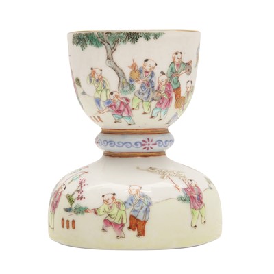 Lot 172 - A Chinese famille-rose 'boys' candlestick, 20th century
