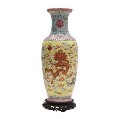 Lot 104 - A Chinese famille-rose yellow-ground 'dragons' vase, Republic period