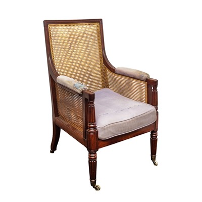 Lot 7 - A Regency mahogany bergère armchair in the manner of Gillows