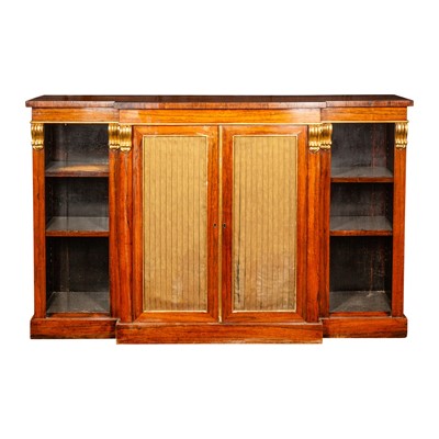 Lot 20 - A Regency rosewood and parcel gilt breakfront open bookcase in the manner of Gillows
