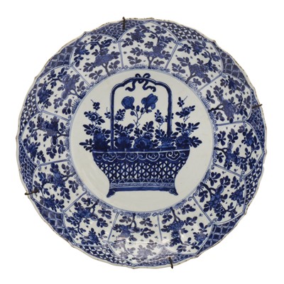 Lot 56 - A Chinese blue and white 'flower basket' charger, Qing dynasty, Kangxi period