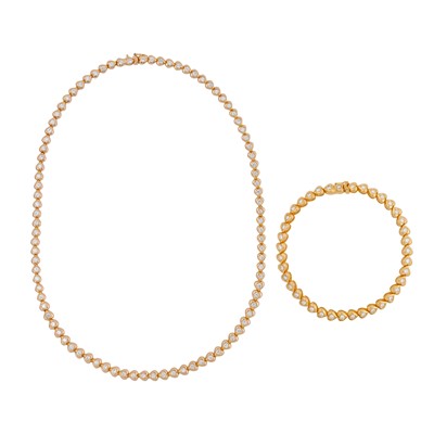 Lot 411 - A diamond heart necklace and bracelet suite