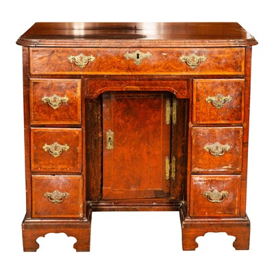 Lot 31 - A George II burr walnut and oak crossbanded kneehole desk