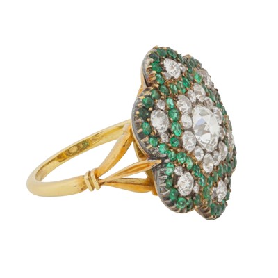 Lot 244 - An emerald and diamond flower ring