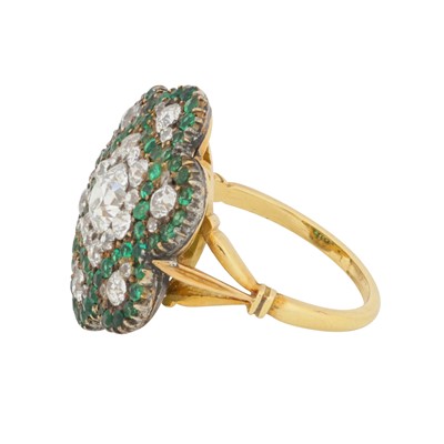 Lot 244 - An emerald and diamond flower ring