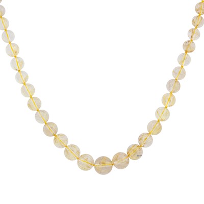 Lot 295 - A rutilated quartz bead necklace