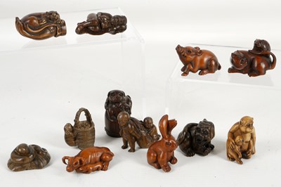 Lot 522 - Japanese wooden netsuke studies of cat and rat,...