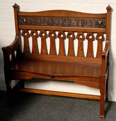 Lot 820 - A good Arts & Crafts hall bench, settle in oak...