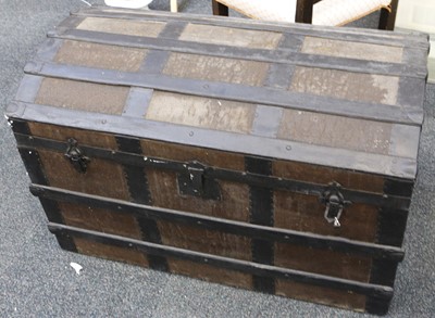 Lot 536 - A dome top shipping trunk, wood and metal...