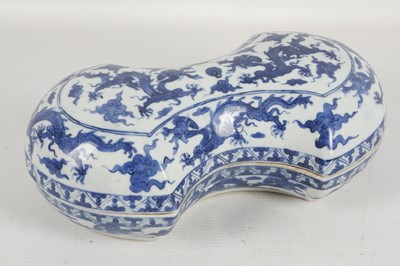 Lot 541 - A Chinese blue and white 'dragons' cash-shaped...