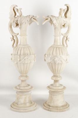 Lot 476 - A pair of 20th century alabaster ewers,...